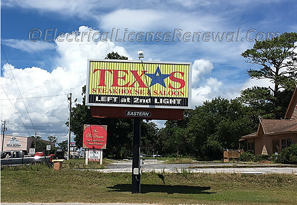 A pole mounted sign is not a building, but it is considered a structure.