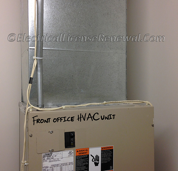 The class 2 thermostat cables are permitted to be secured to the EMT raceway containg power conductors for the same air conditioner.