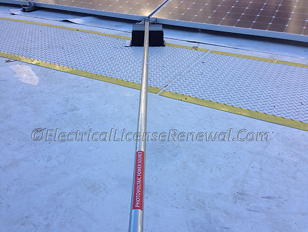 The rooftop raceway is installed in a wet location above grade. The interior of the raceway is considered to be a wet location. Are there any code violations in the image? Hint: Label.