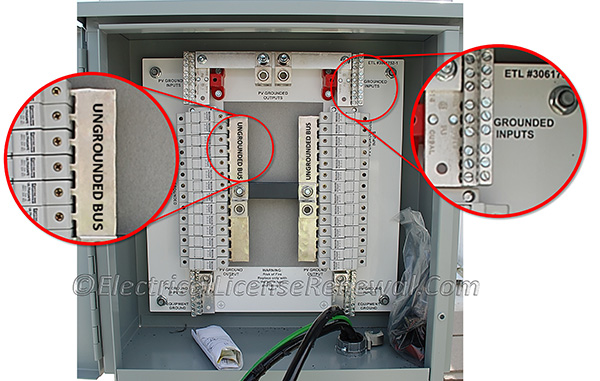 This DC combiner box is in the process of being wired. The busbars in the DC combiner box are marked to that the phase arrangement is evident.