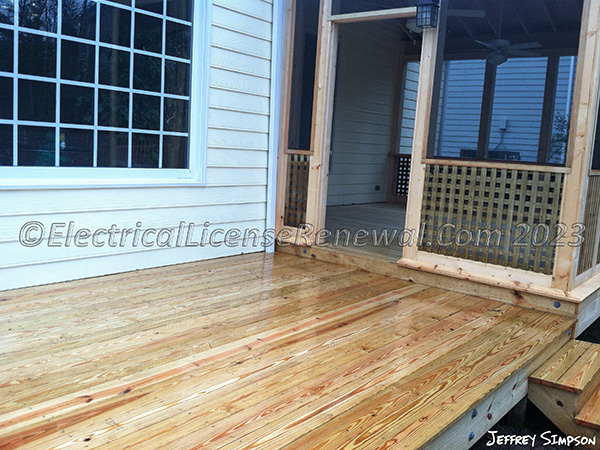 In Oregon, decks or porches located at grade level with an area of less than 20 sq. ft. are not required to have an additional receptacle installed.