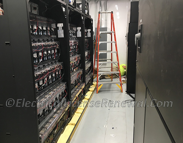 New requirements appear in the NEC for battery rooms. Look closely and you might see another electrician laying down on the job.