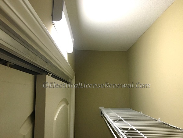 In NC,&nbsp;certain types of luminaires are permitted in that area directly above the door as in the image.