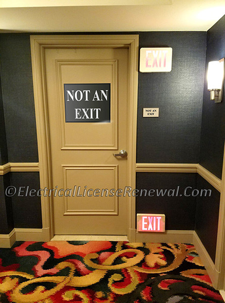 Equipment that has the physical appearance of a life safety device (like this door that is clearly labeled as "not an exit" but yet has an exit sign next to it) or appliance but does not perform its apparent life safety function shall be prohibited.
